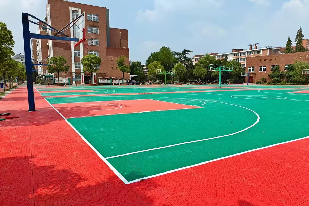 Outdoor basketball court with red and green surfacing